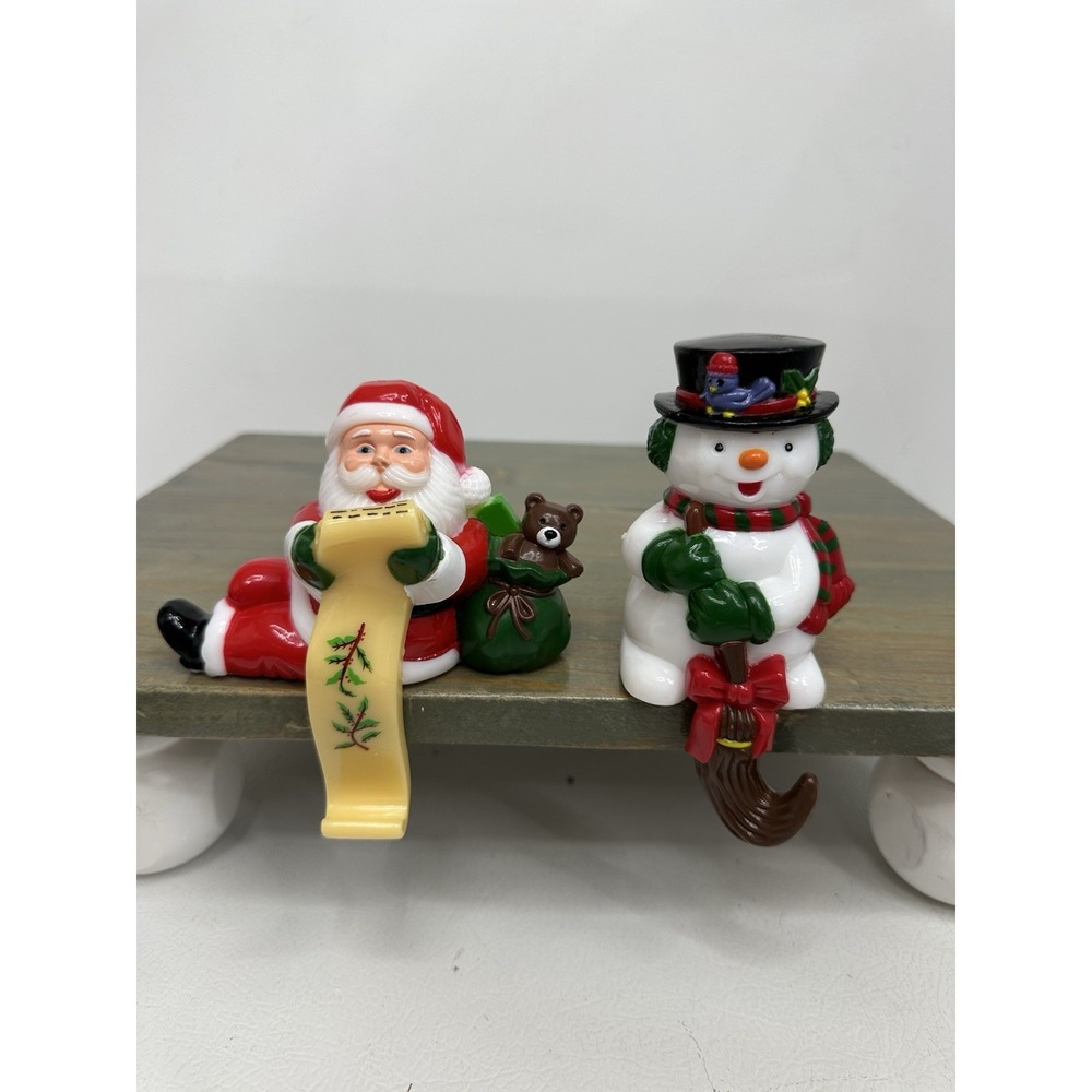 2 Vintage Celluloid Stocking Holders Hangers Hooks Santa Claus Frosty Snowman 5"